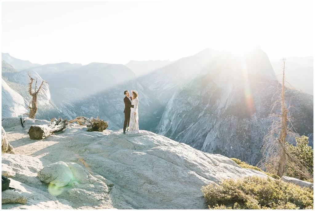 couple at Glacier Point for their sunrise Yosemite elopement ceremony